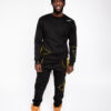 A man wearing a SoulieLove Collections tracksuit
