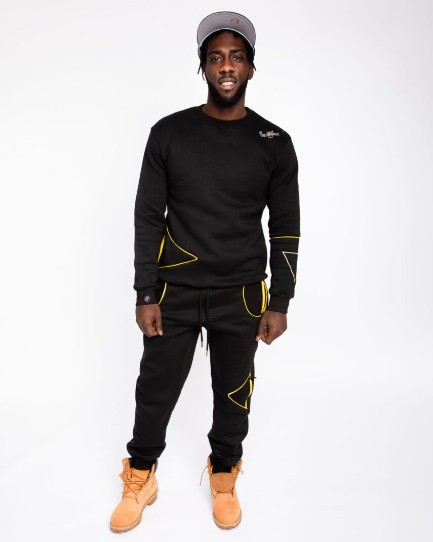 A man wearing a SoulieLove Collections tracksuit